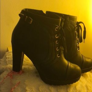 Black booties with gold accents